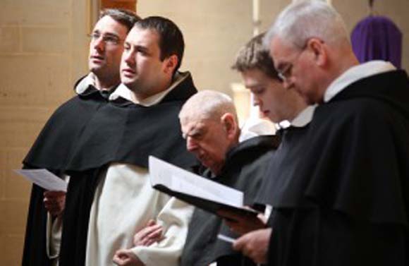 Friars praying the Stations